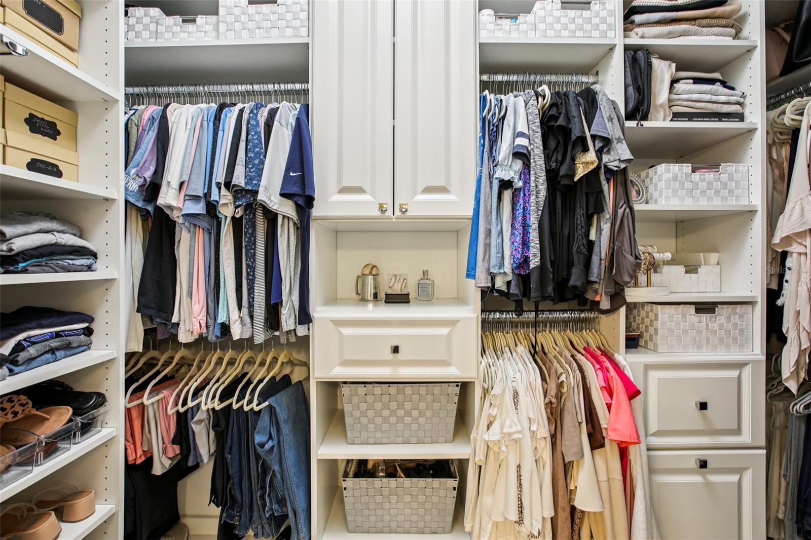 Custom walk-in closet in primary bathroom