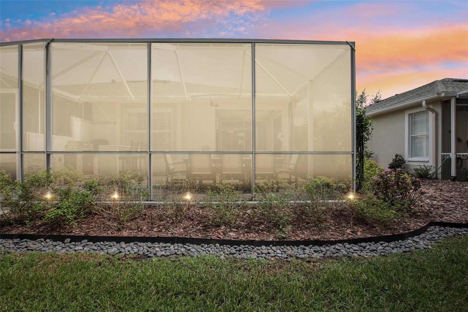 Landscape lighting surrounds the home