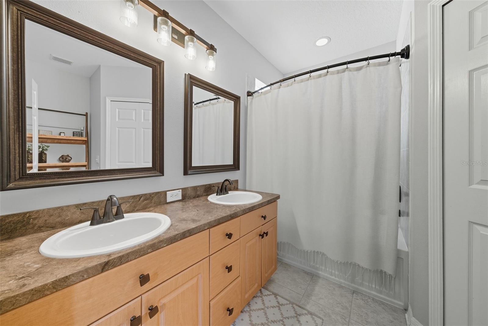 Primary bath with dual vanity and walk in closet