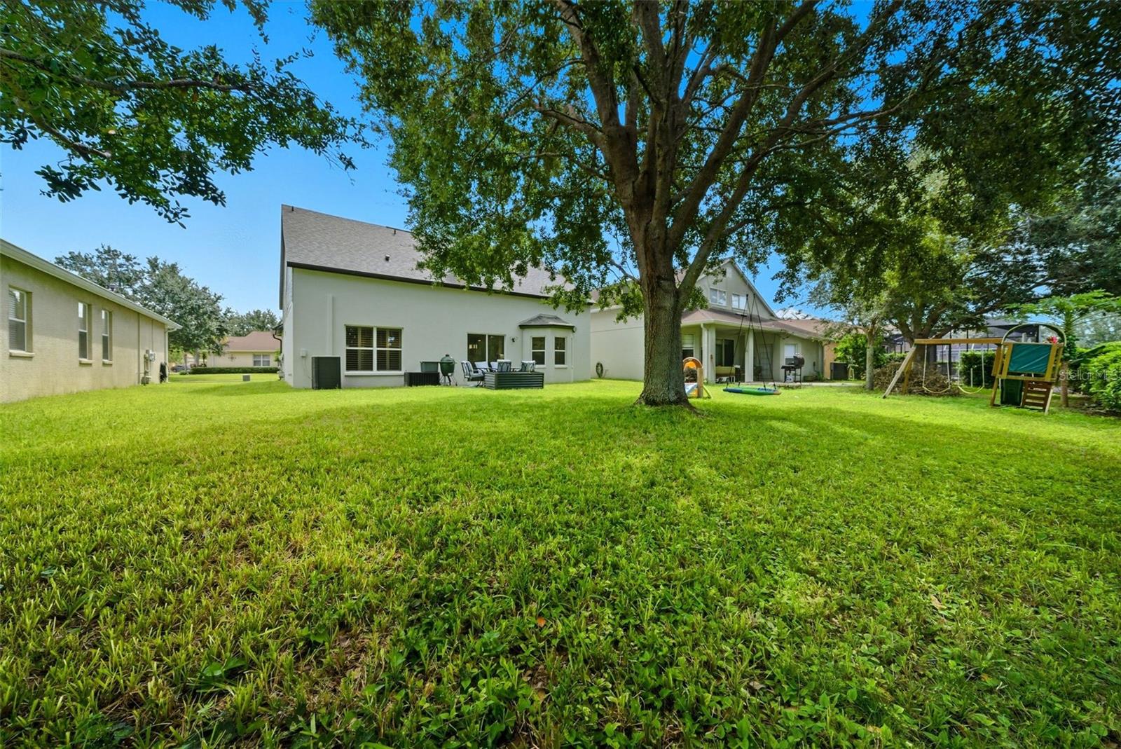 Plenty of shade under the tree to enjoy your backyard!