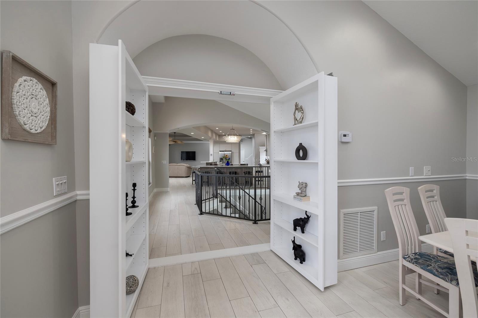 Book Case which opens and closes to locks the west wing