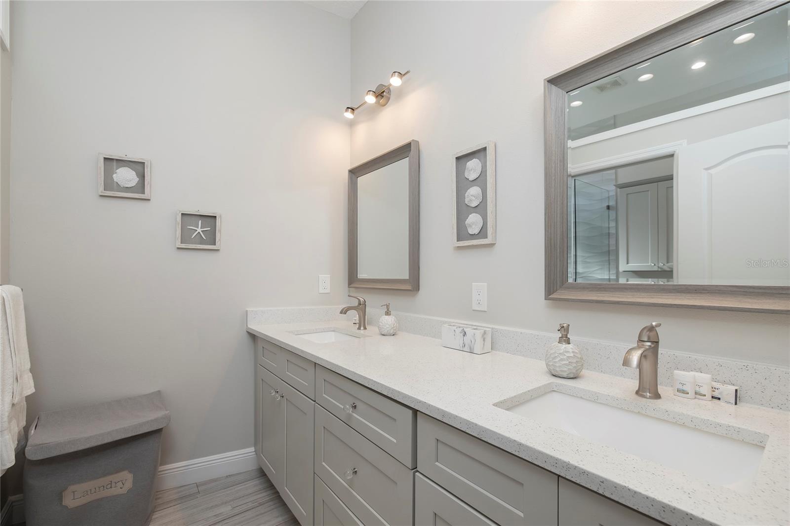 West wing primary bathroom with double sinks