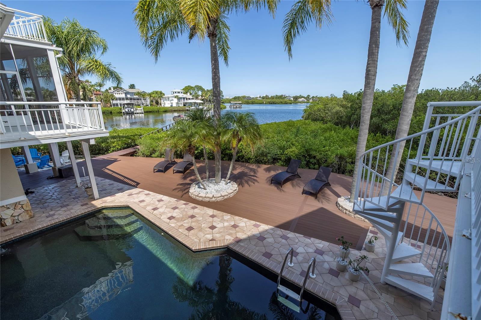 View from balcony overlooking pool and bayou