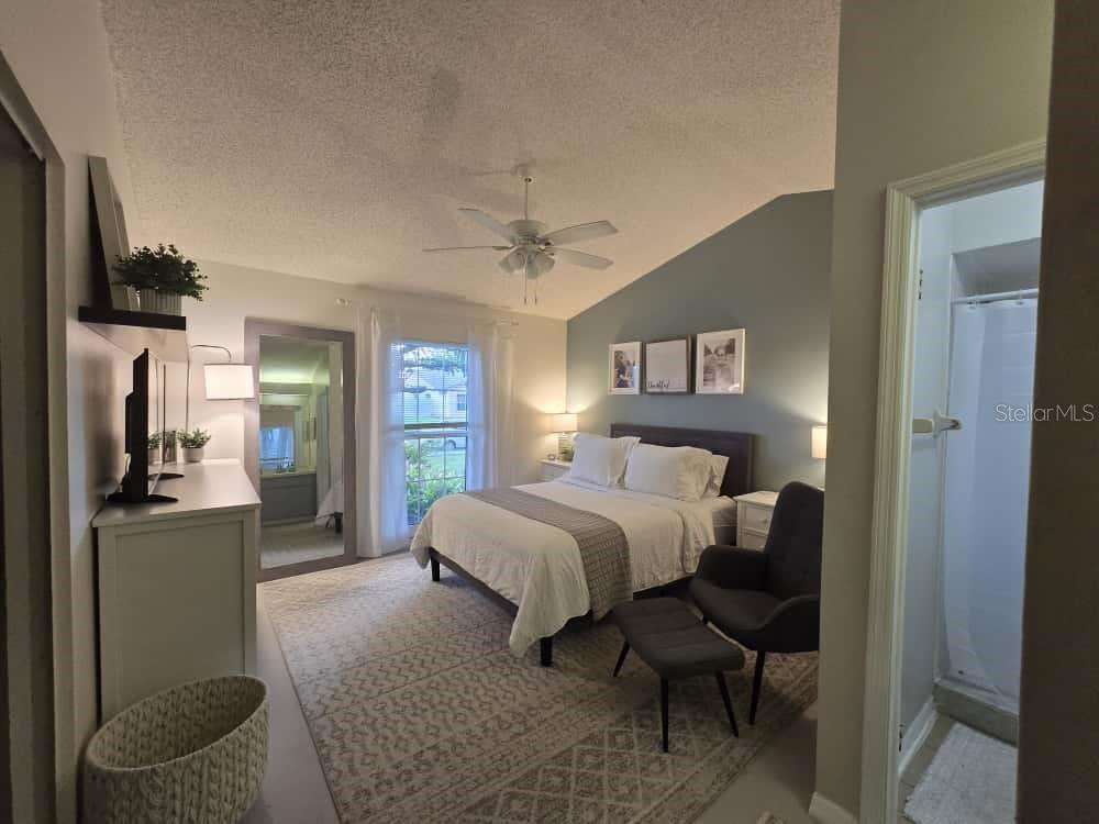 Master bedroom with ensuite bath; high ceilings, ceiling fan and large window