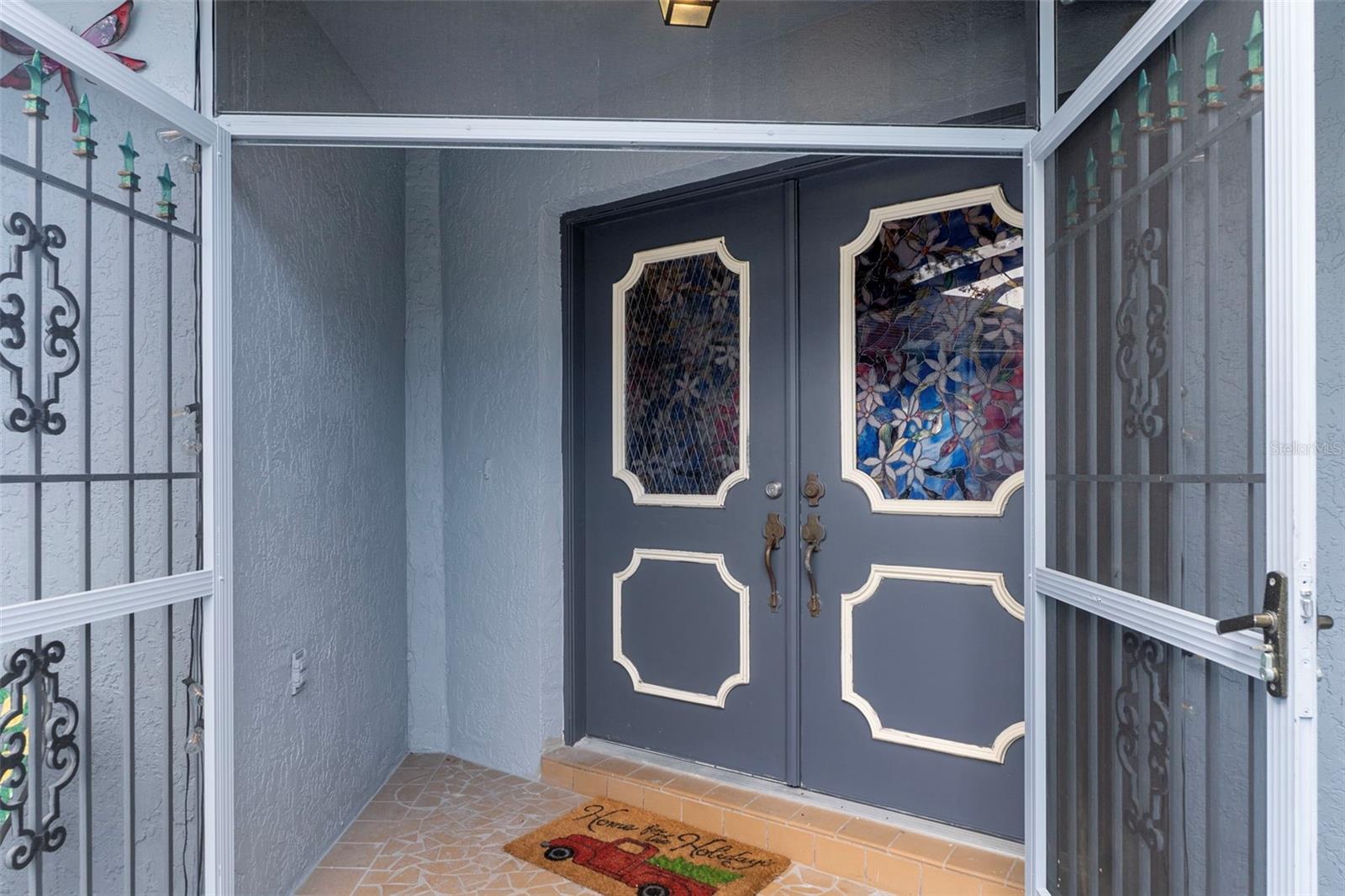 Notice the custom made screen doors providing a secure entrance