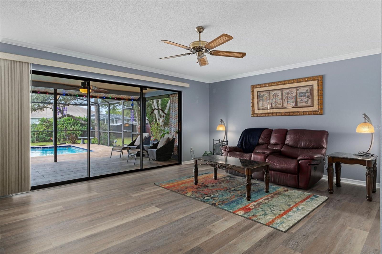 The living room has  elegant crown molding in the living room