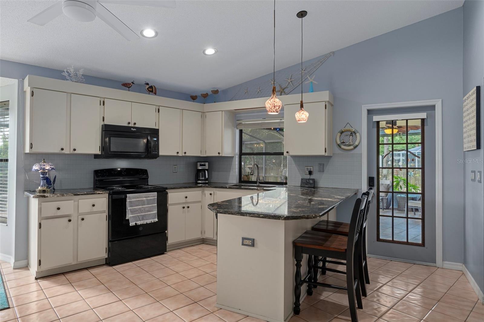 This kitchen has an abundance of cabinets and lots of counter top space