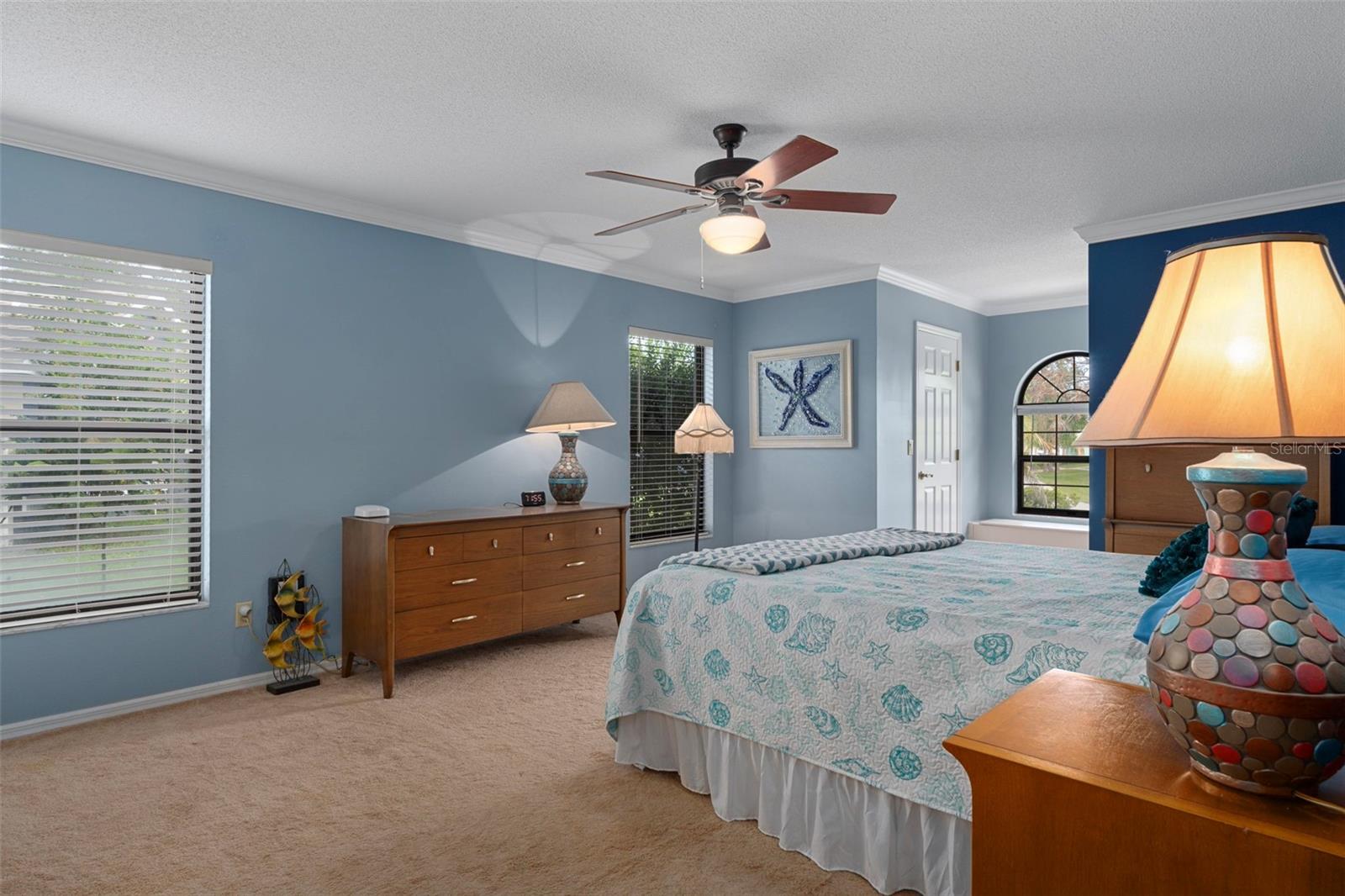 Notice the gorgeous crown molding in the master bedroom