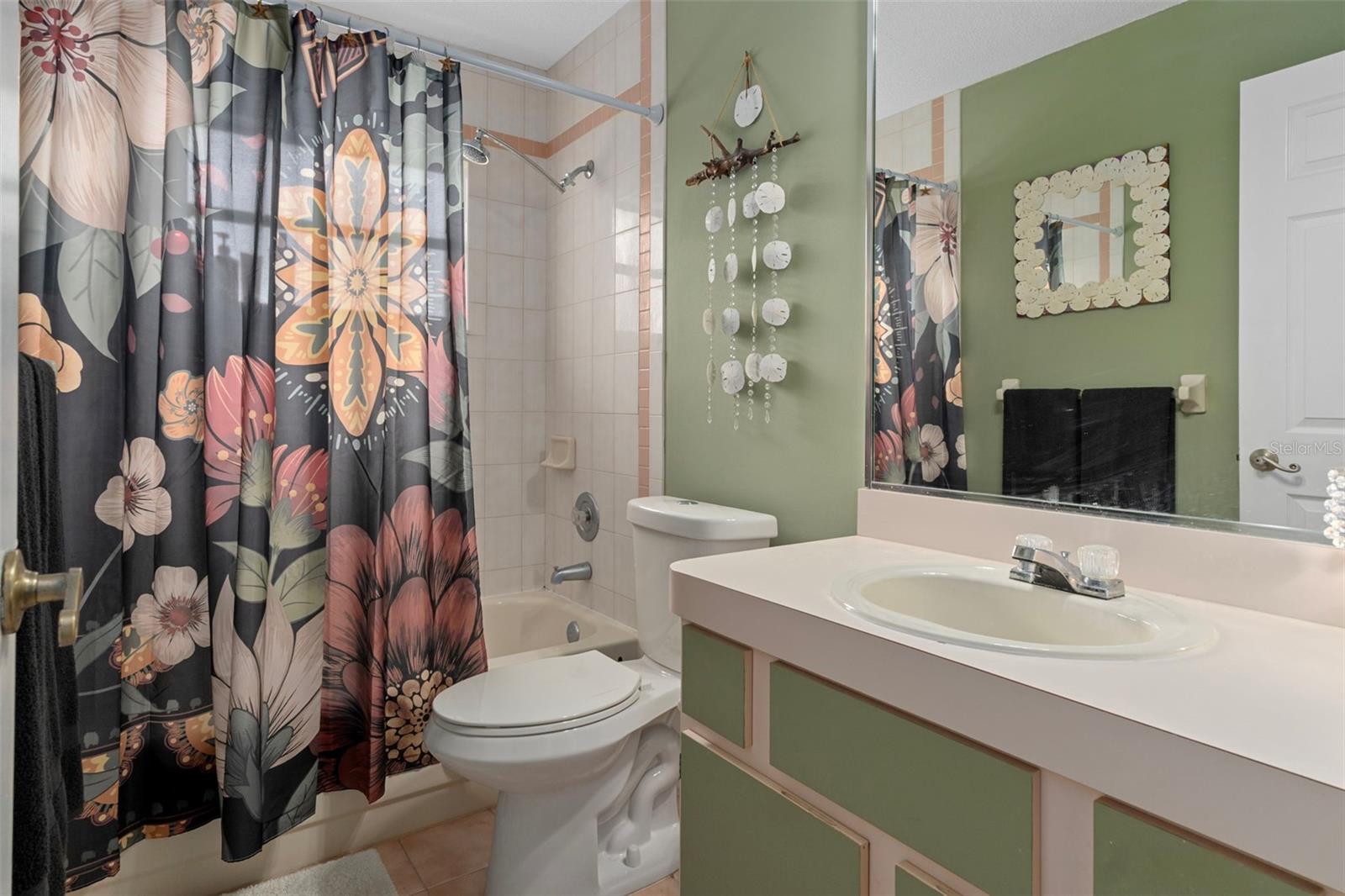 There is a tub/shower combo. There is a newer toilet in the guest bathroom