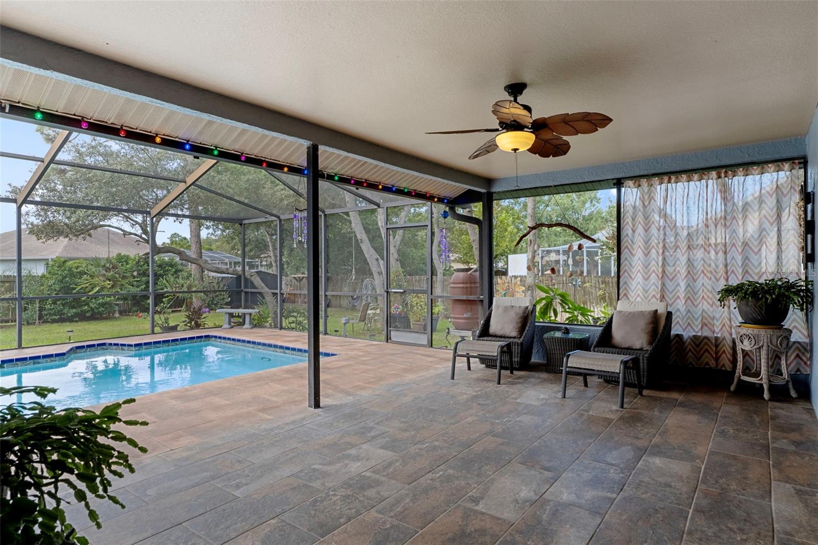Notice the Lovely outdoor tile in the huge Lanai and around the pool.