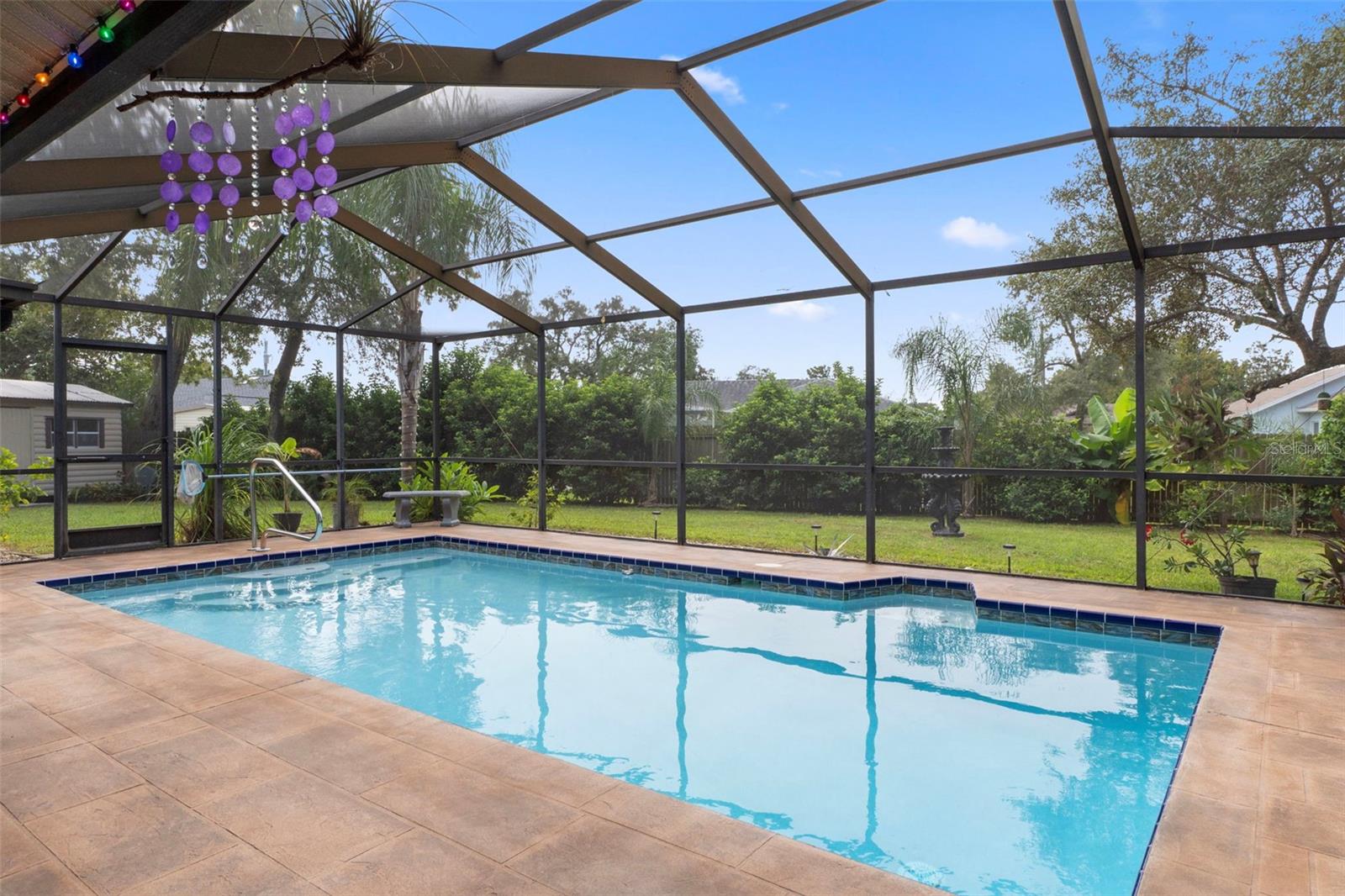 Notice the gorgeous outdoor tiles by the pool