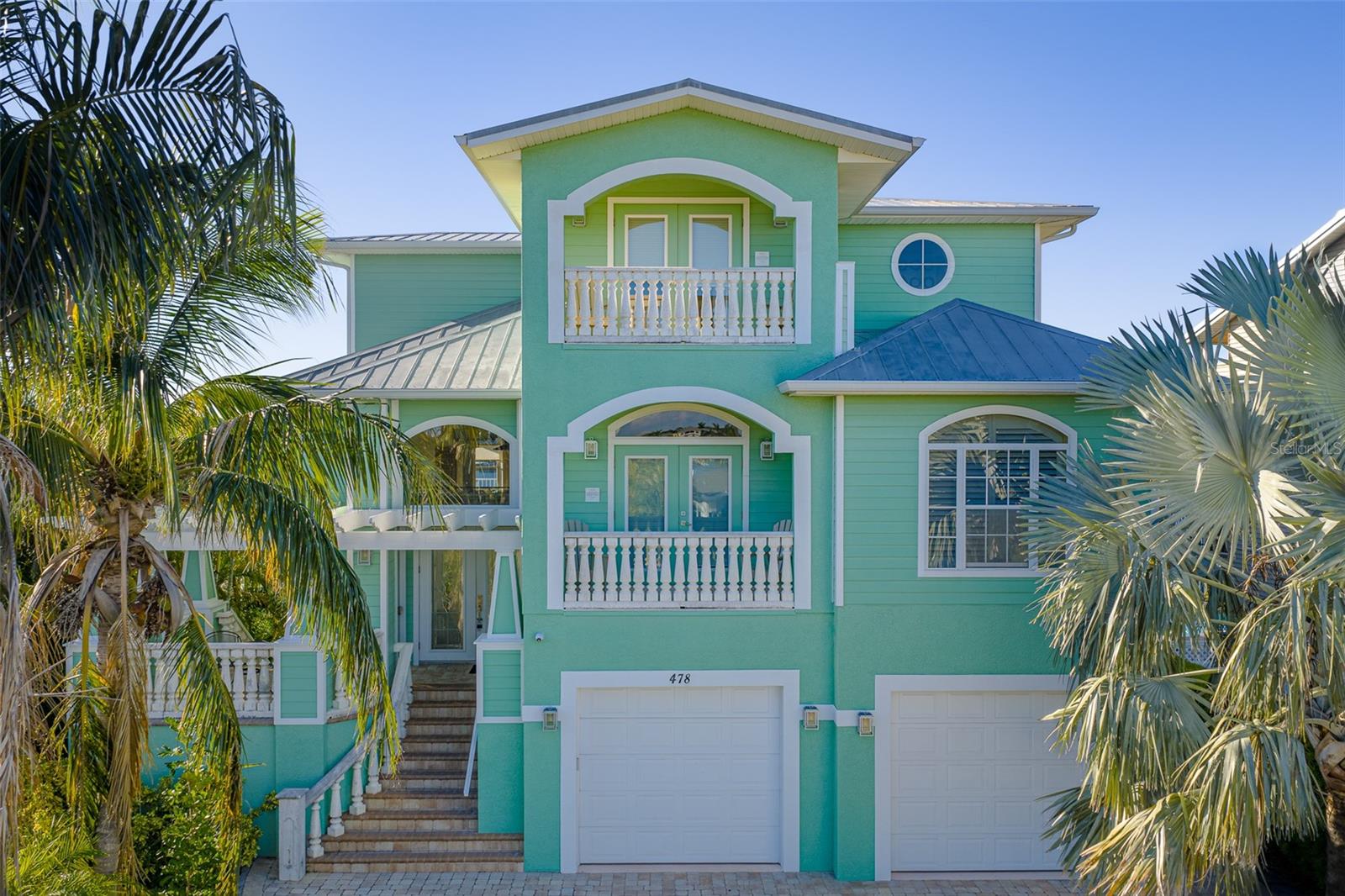 Elevated waterfront construction, engineered for storm protection and hurricane resilience-enjoy peace of mind in this safe harbor haven.