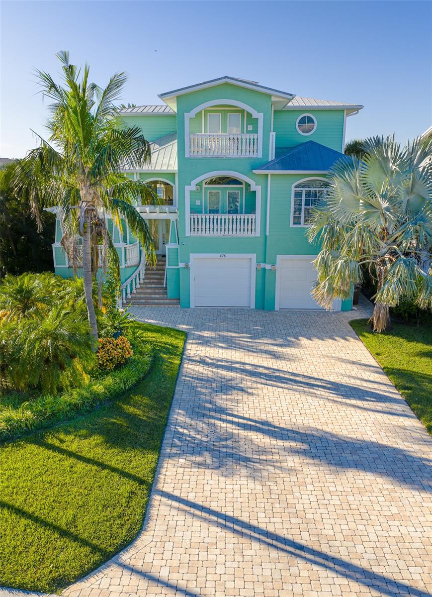 Approached by a long paved driveway, this  property will elevate your coastal expectations.