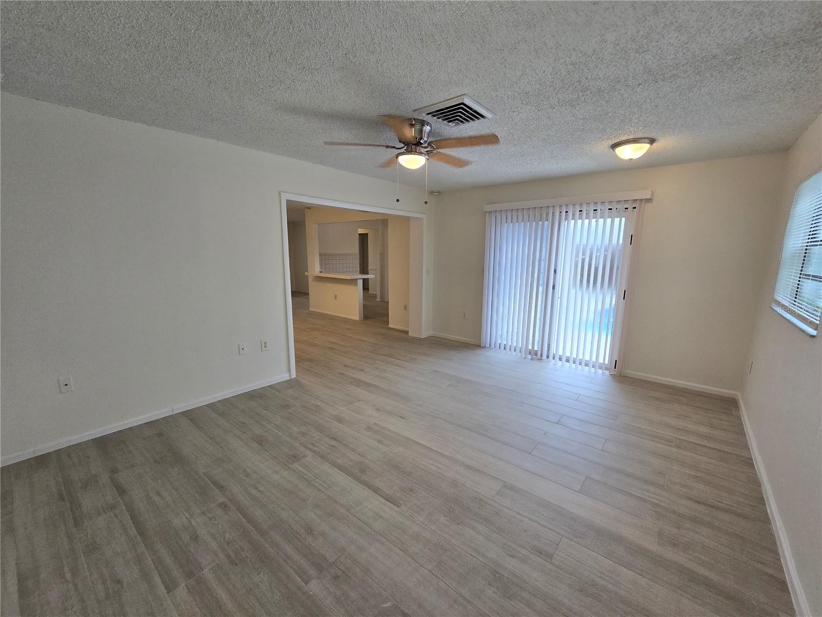 Family Room, with french door that lead out to the backyard and pool