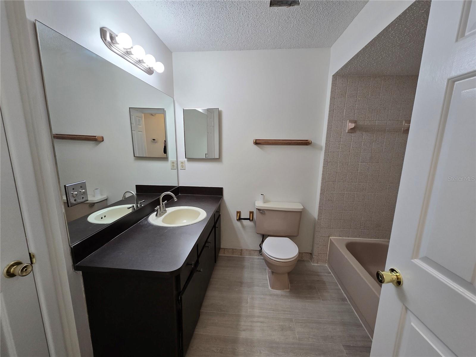 2nd Bath, can be accessed through the hallway and/or the 2nd bedroom