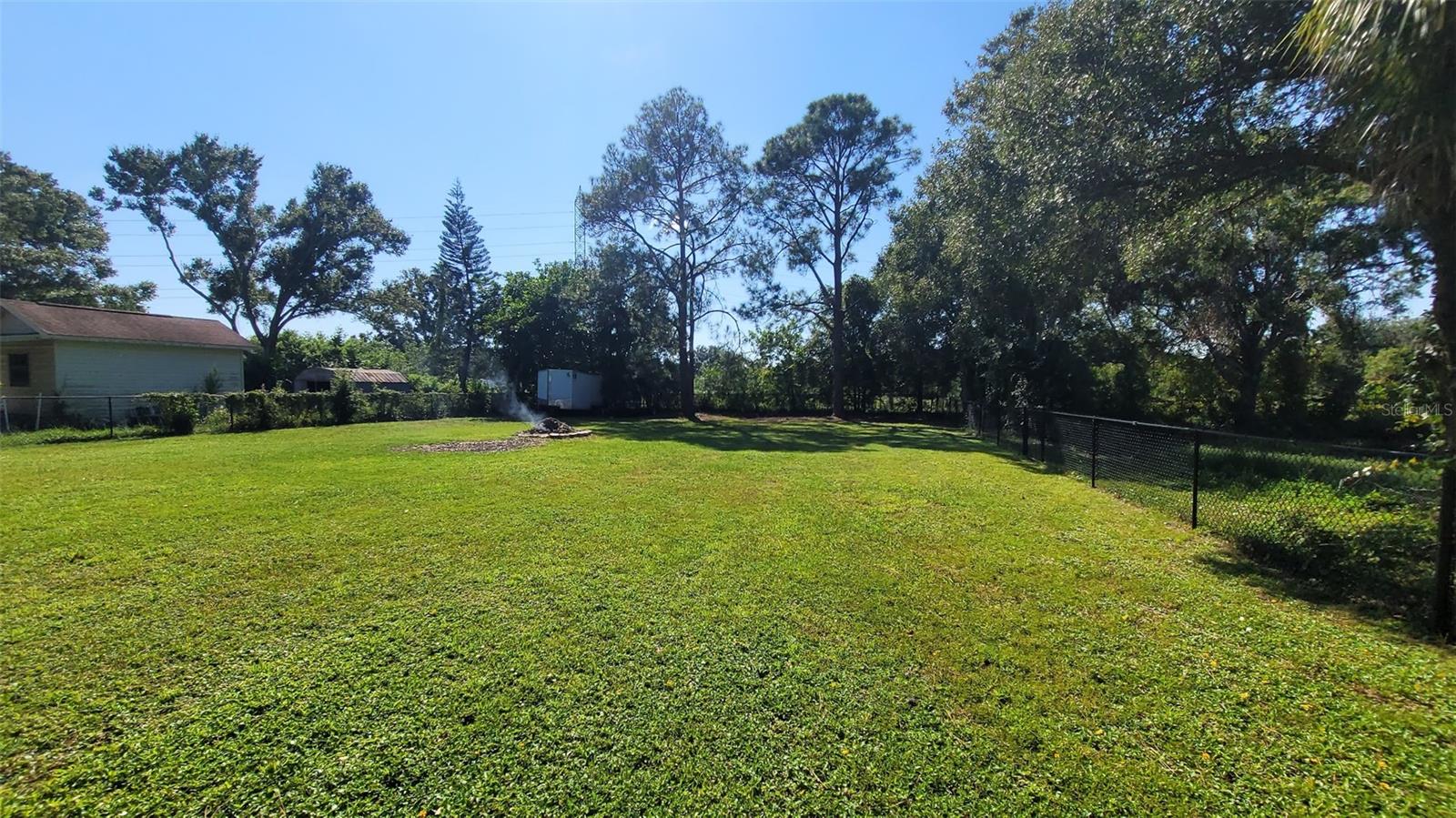 Imagine your family enjoying this back yard as is OR however you choose to set it up. There is room for a multi sports court, think tennis, pickleball, or basketball. Perhaps a custom built in law suite" Or perhaps a garden? The possibilities are there.