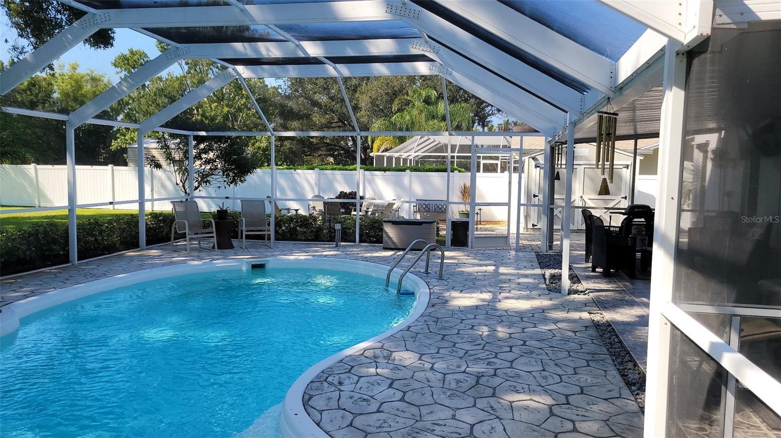 This screened in pool area offers such a variety of space for entertaining and relaxing!