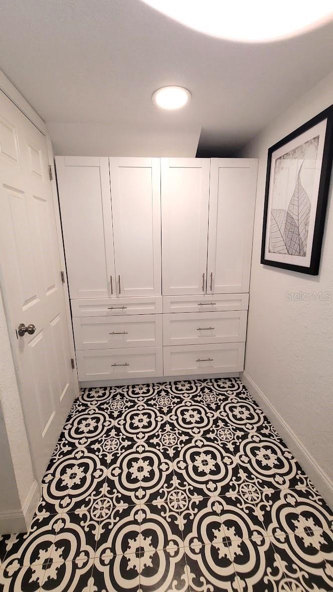 Plenty of cabinets and storage space in this 1/2 bath.