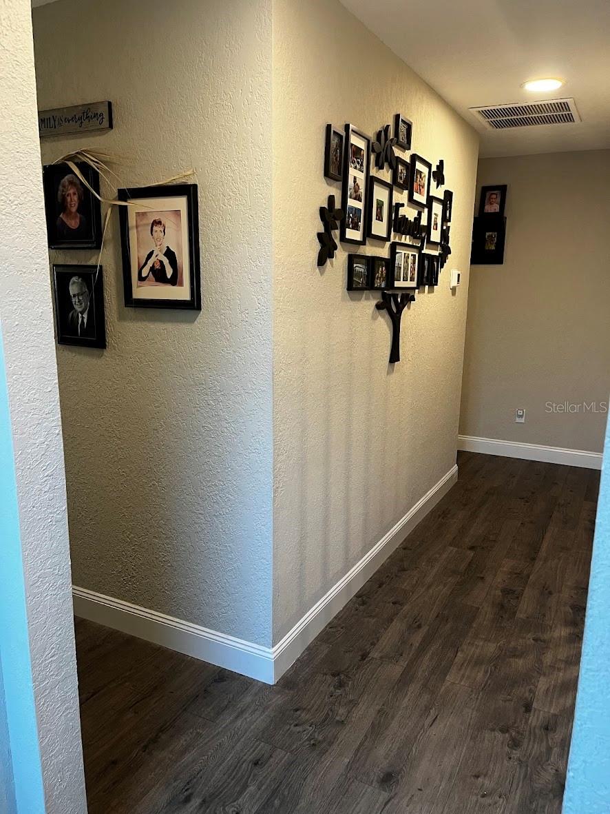 The hallway at the top of the stairs that lead to the 3 additional bedrooms, bathroom, and TV Area.