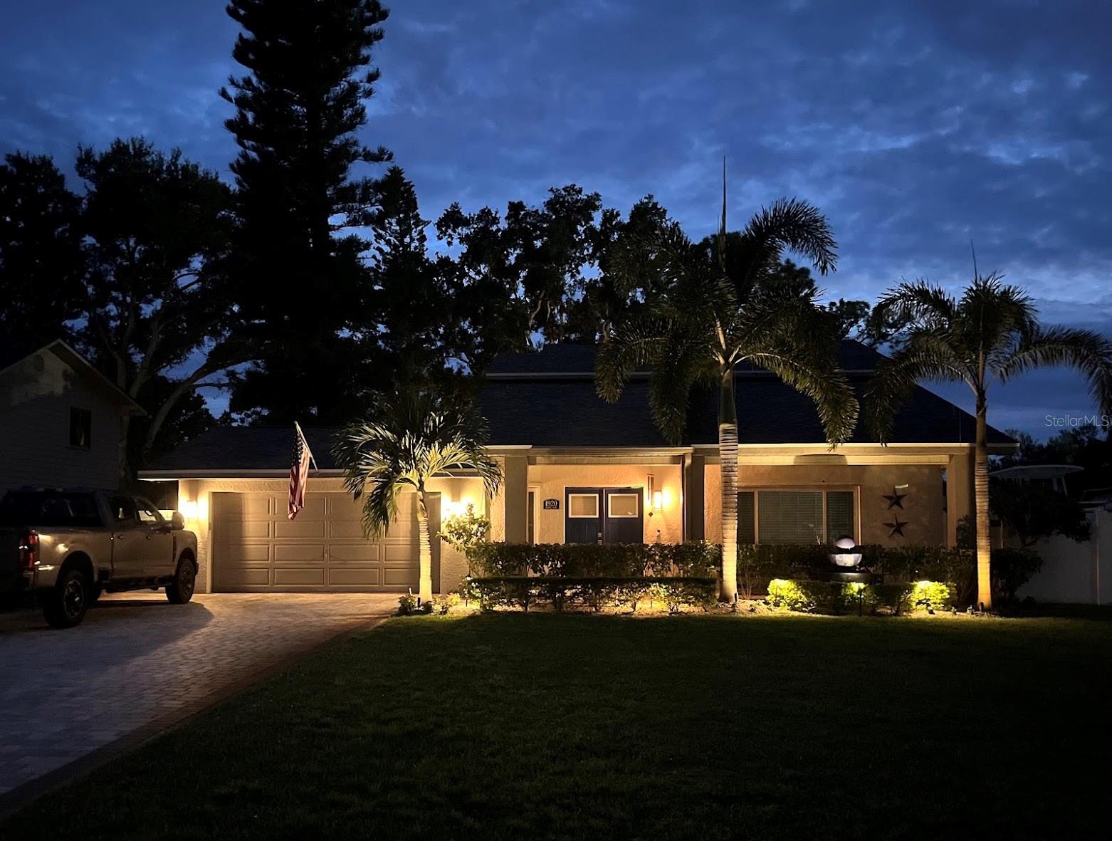Gorgeous lighting and night time view of the home.