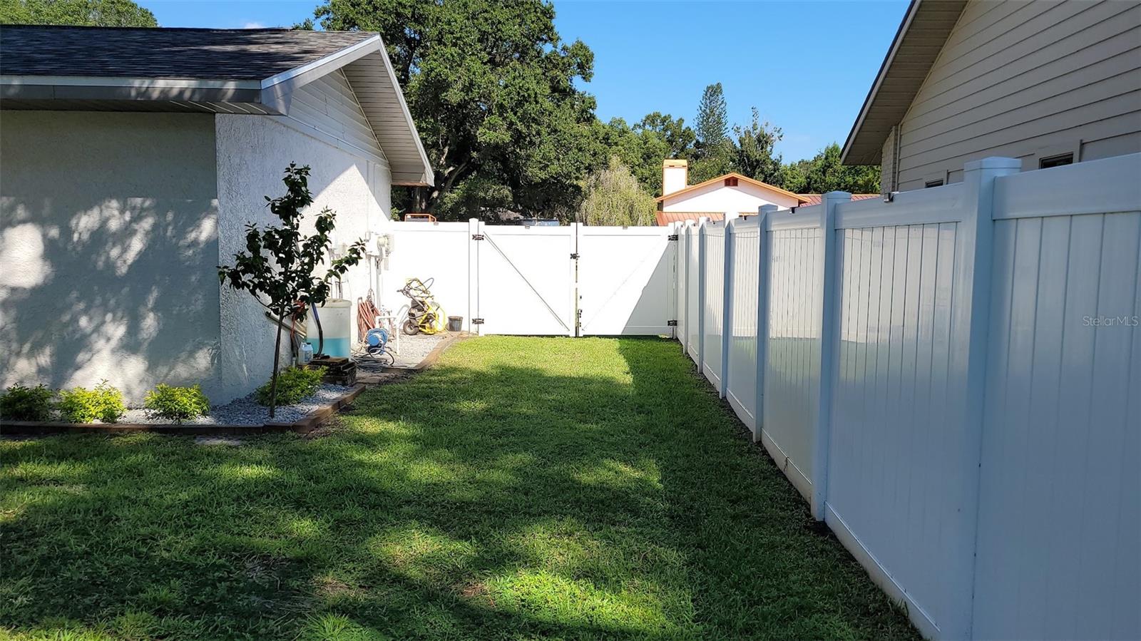 Both sides of the home have gates that lead to the back yard.