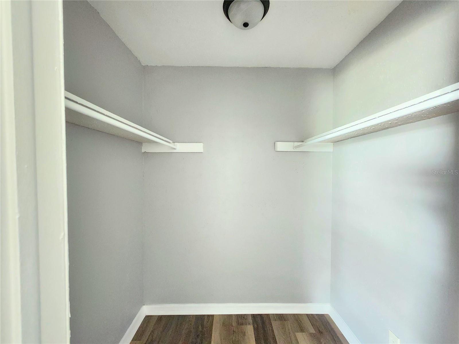Walk-in closet in primary bedroom