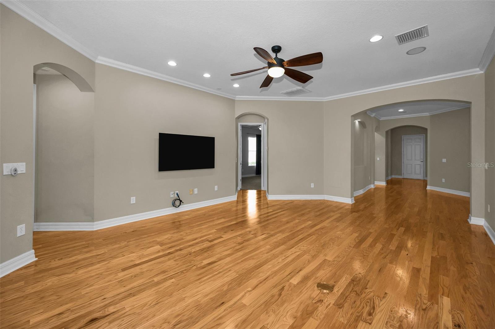 Beautiful archways and upgraded crown molding and baseboards