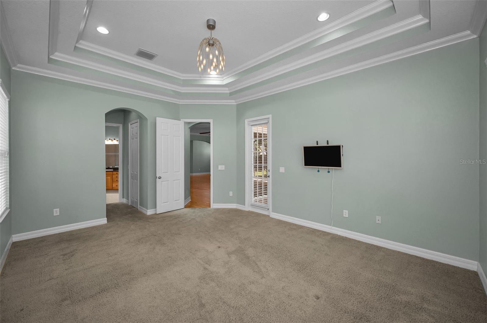 Primary bedroom features chandelier, recessed lighting and 2 walk-in closets