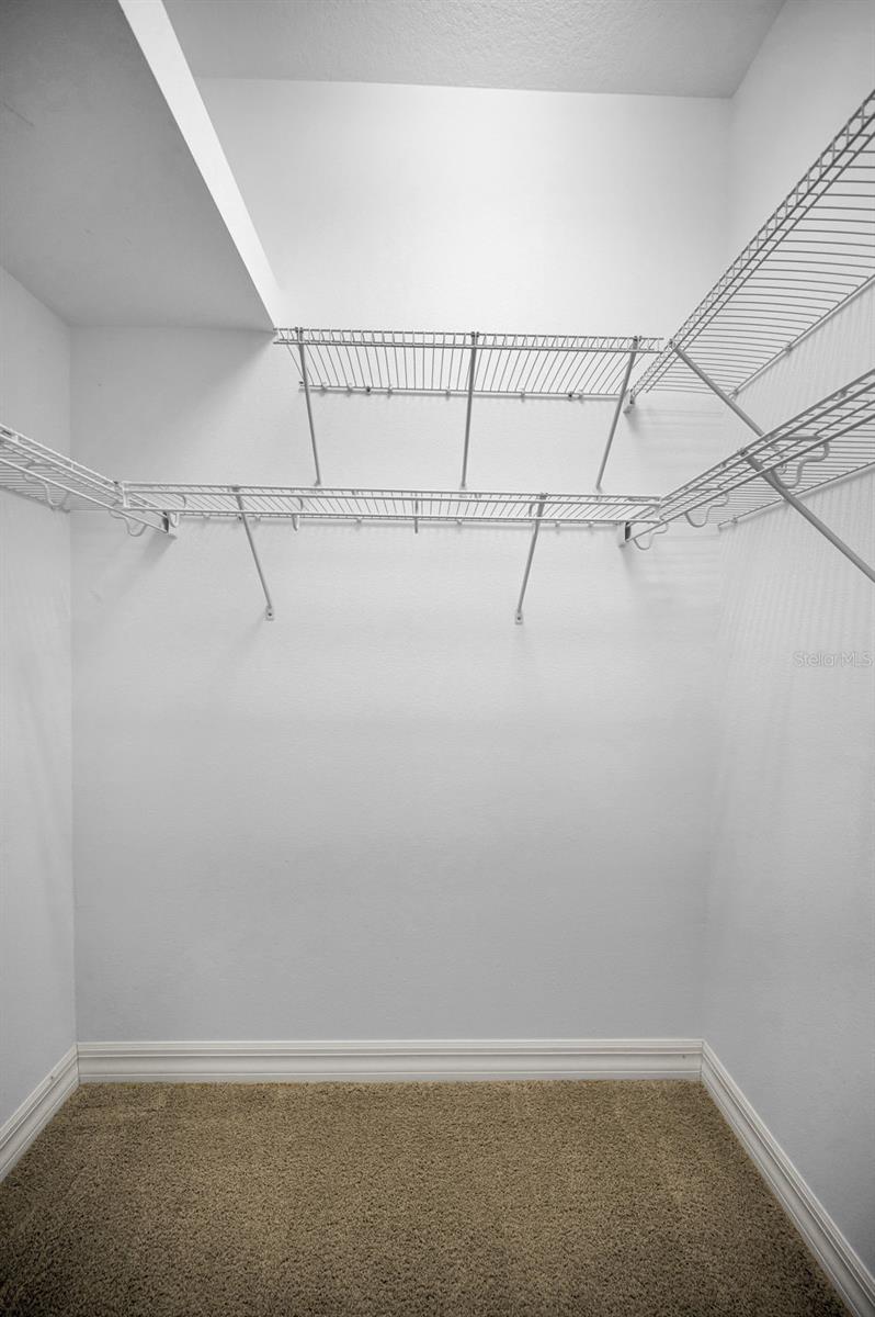 one of two walk-in closets