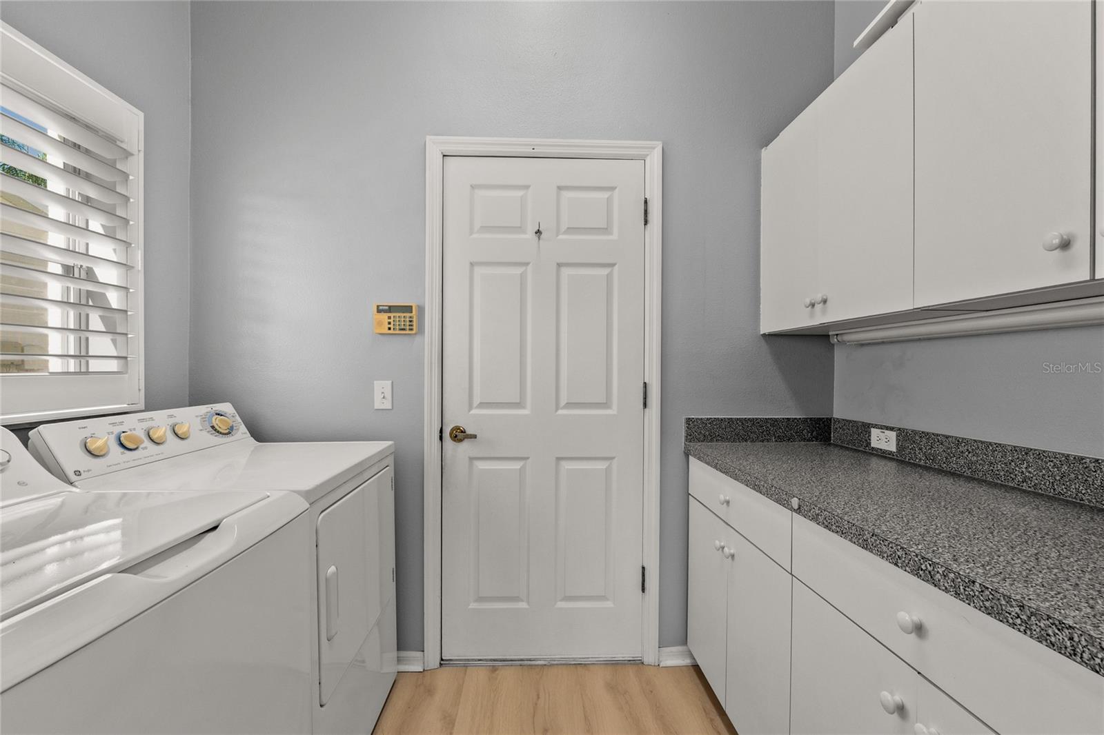Laundry Room - Washer is 2023 and lots of storage here too leading to the Garage
