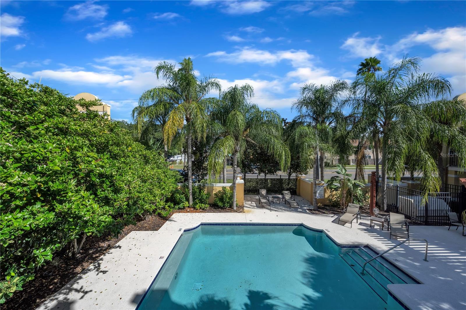 second floor balcony off of the living room. Overlooking pool!