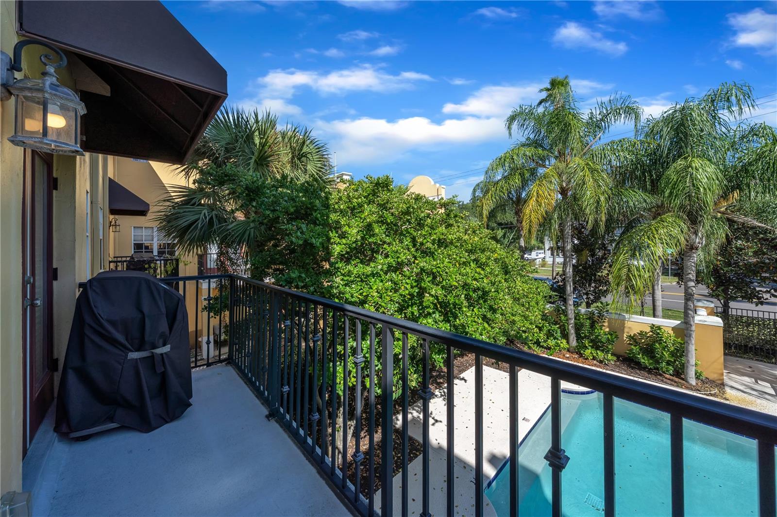 second floor balcony off of the living room. Overlooking pool!