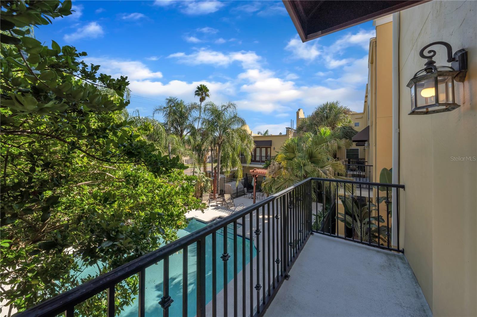 second floor balcony off of the living room. Overlooking pool!