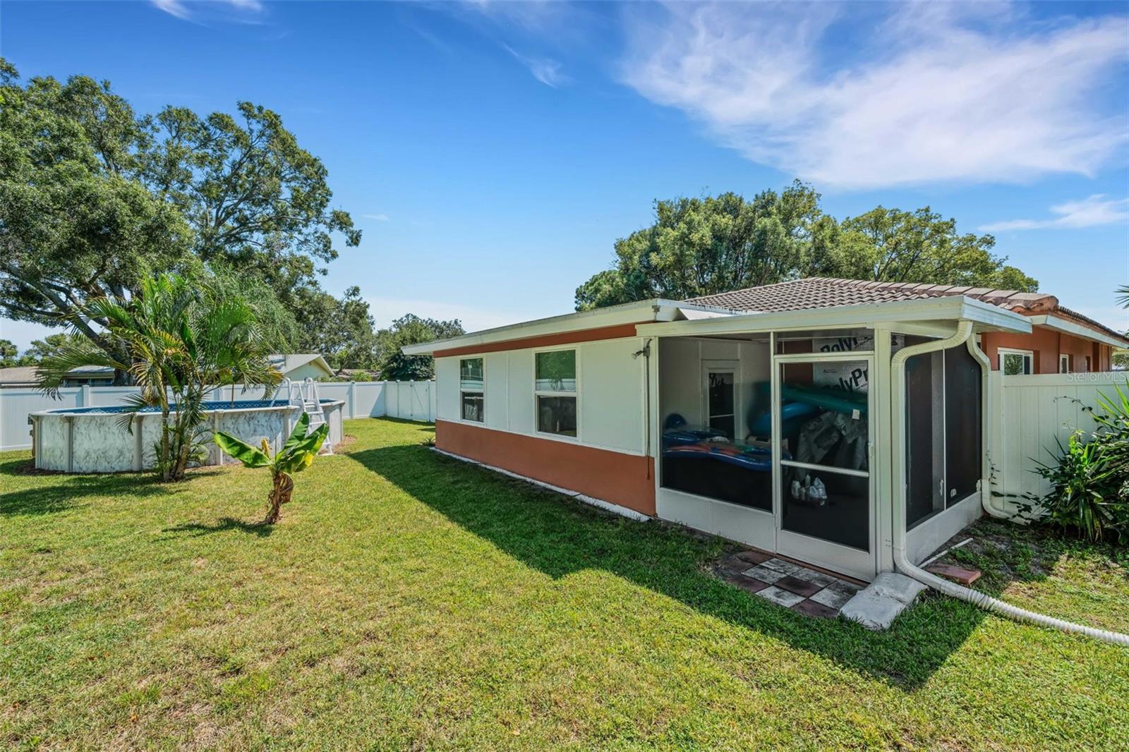 Large yard with vinyl fence