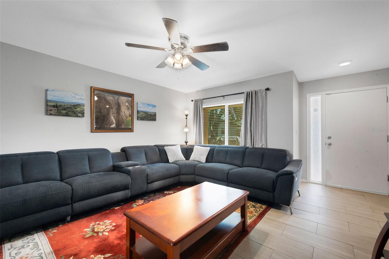 large, modern, neutral Ceramic tile throughout