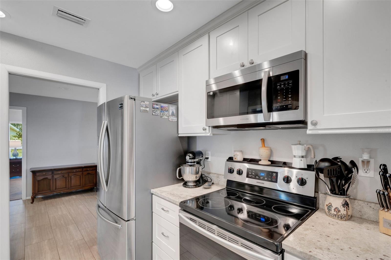 Stainless steel appliances with primary bedroom thru the door