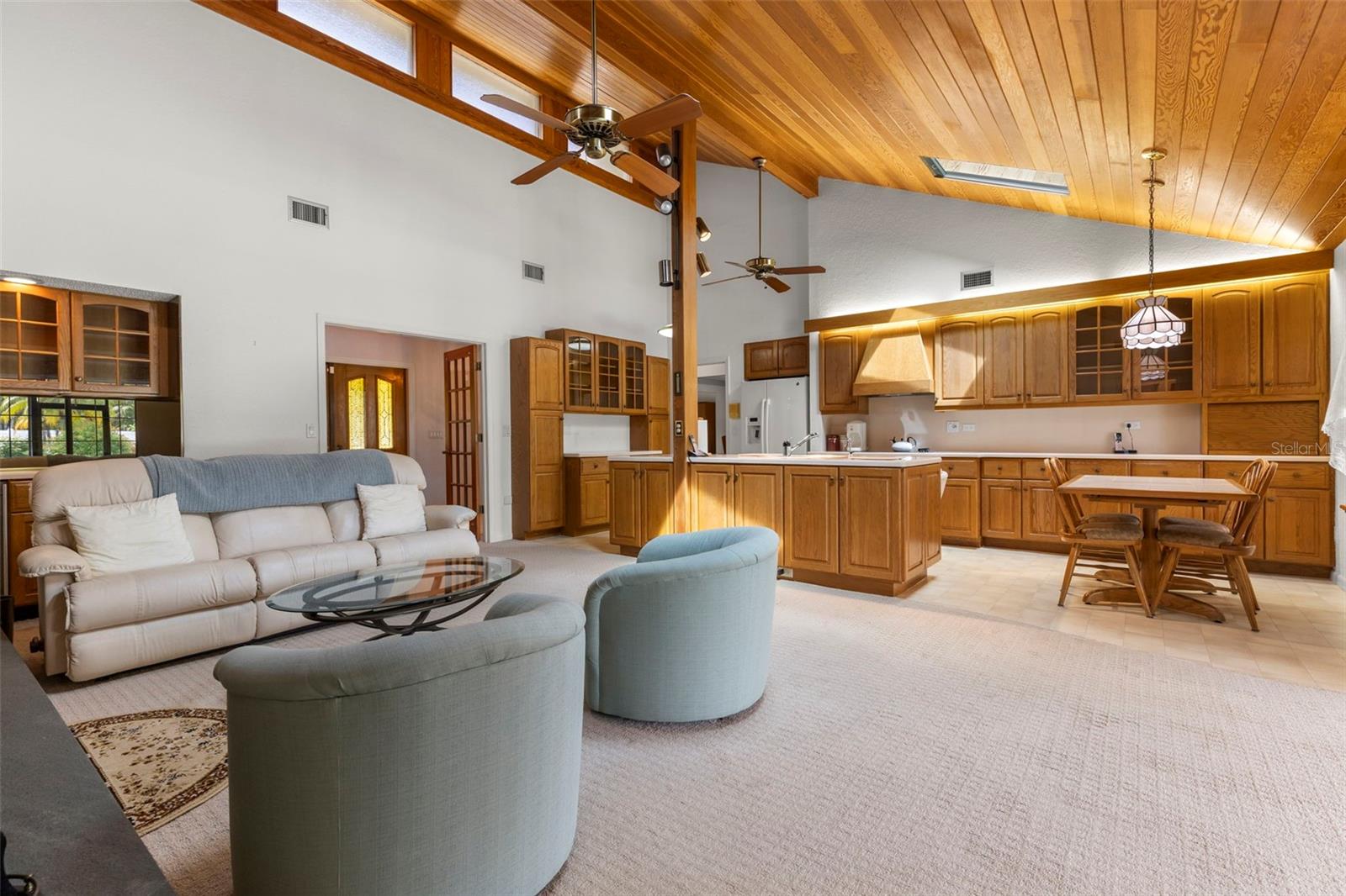 Family Room w Wood Ceilings & Sliders to Lanai