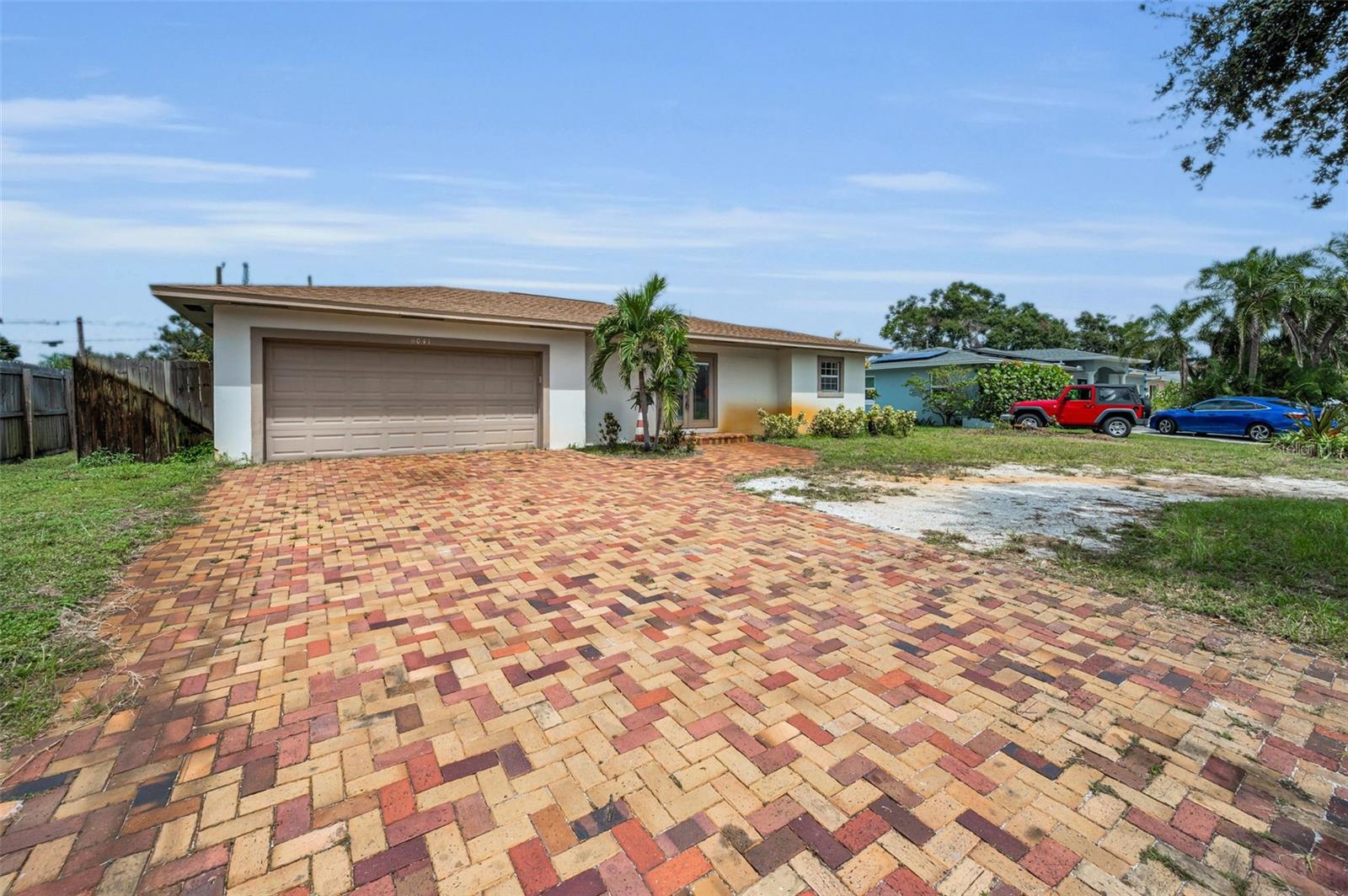 Plenty of space for parking and a rocked circle drive for easy access.