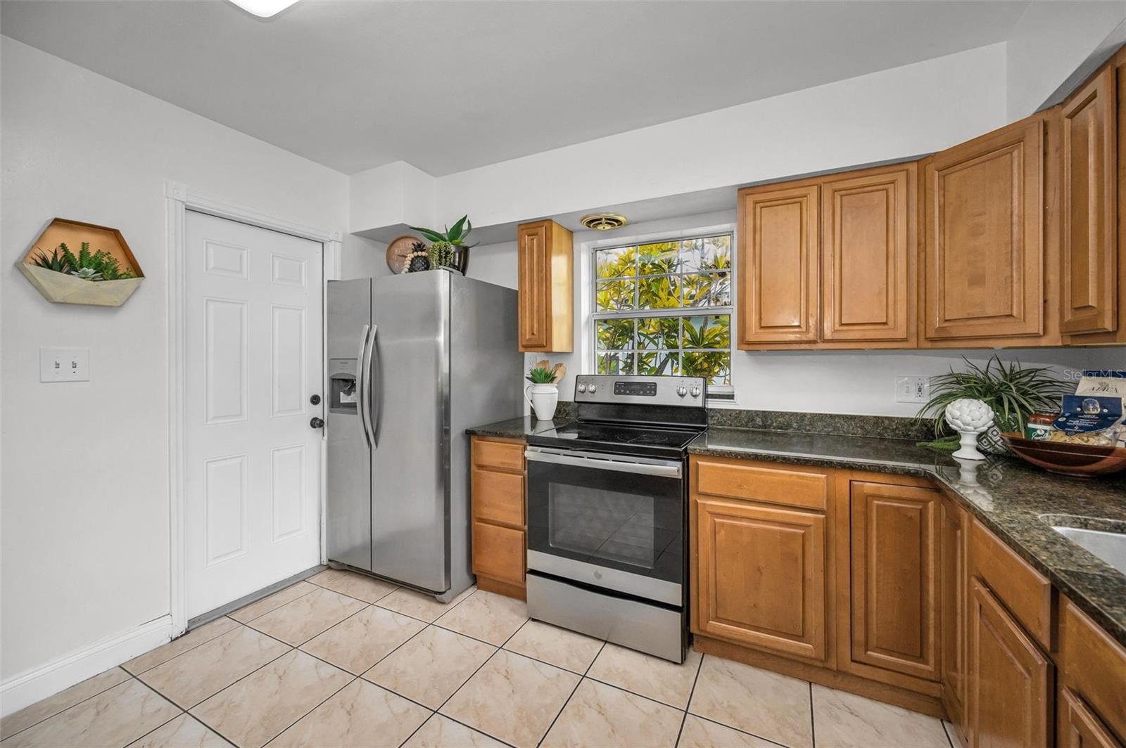 Door in the kitchen accesses the back deck and yard.
