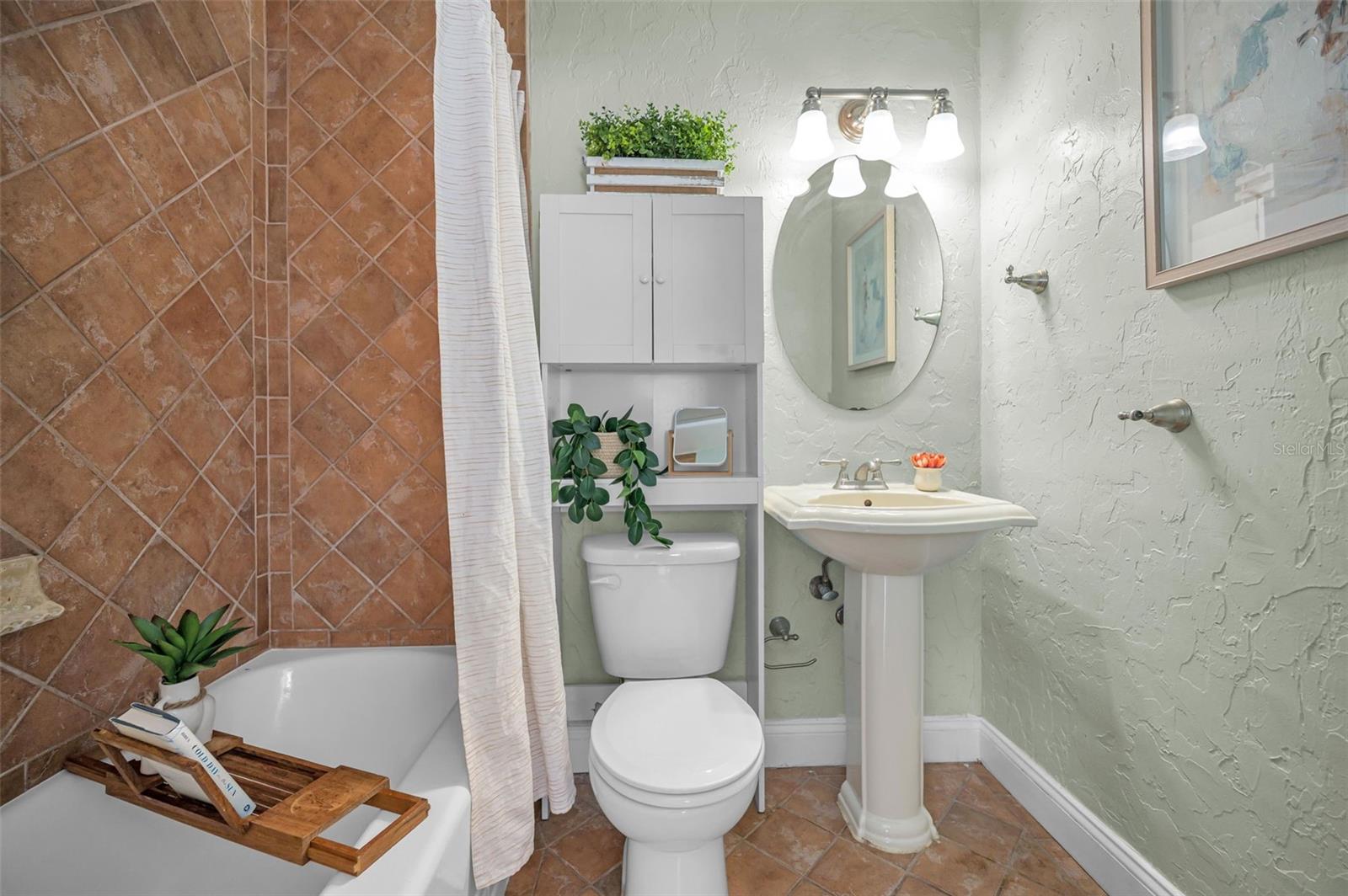 Primary bathroom with tub/shower combo.