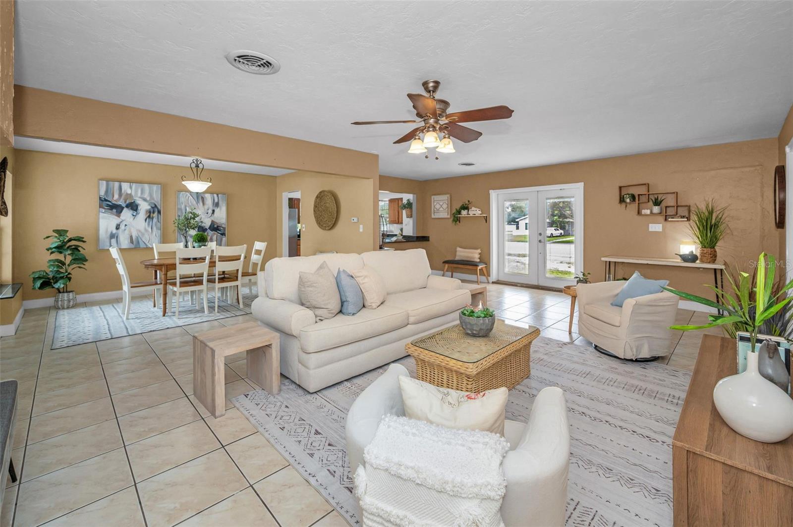 Living area flows with dining and kitchen.
