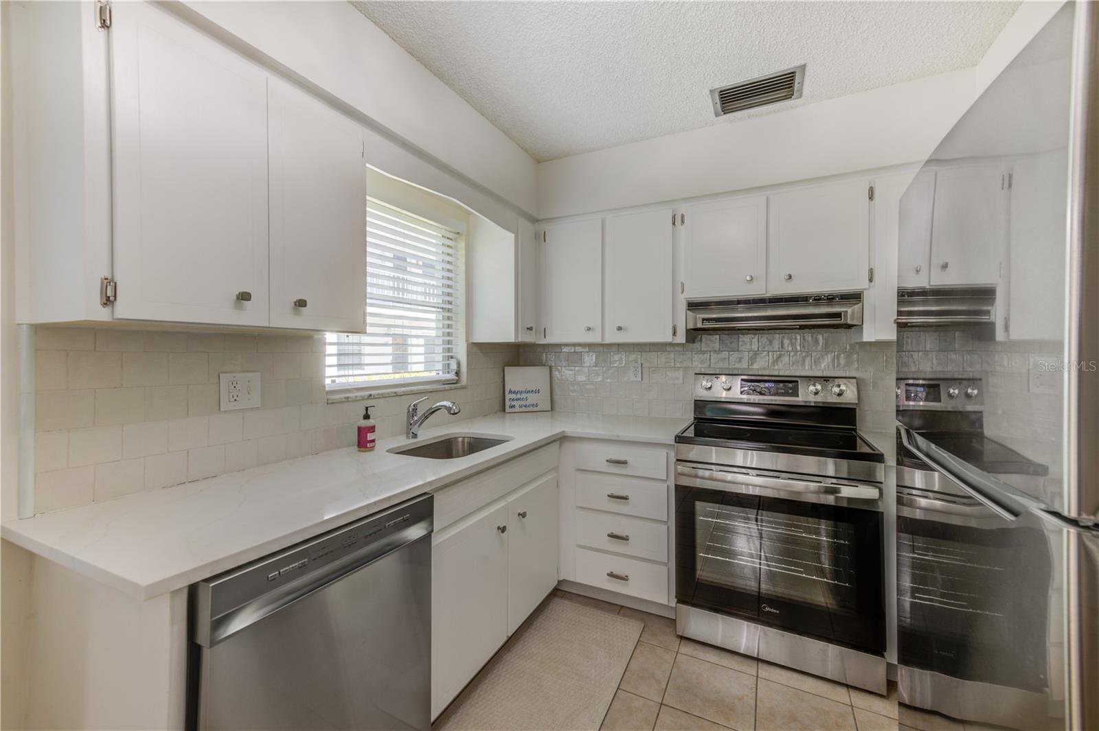 NEW STAINLESS-STEEL APPLIANCES