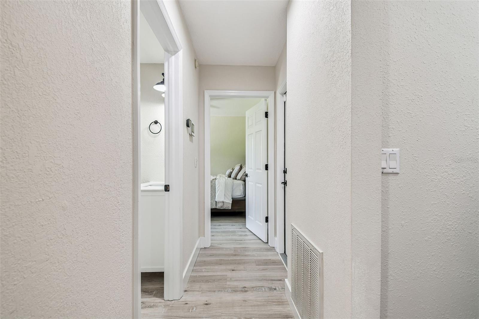 hall off kitchen to bedroom/bath and garage