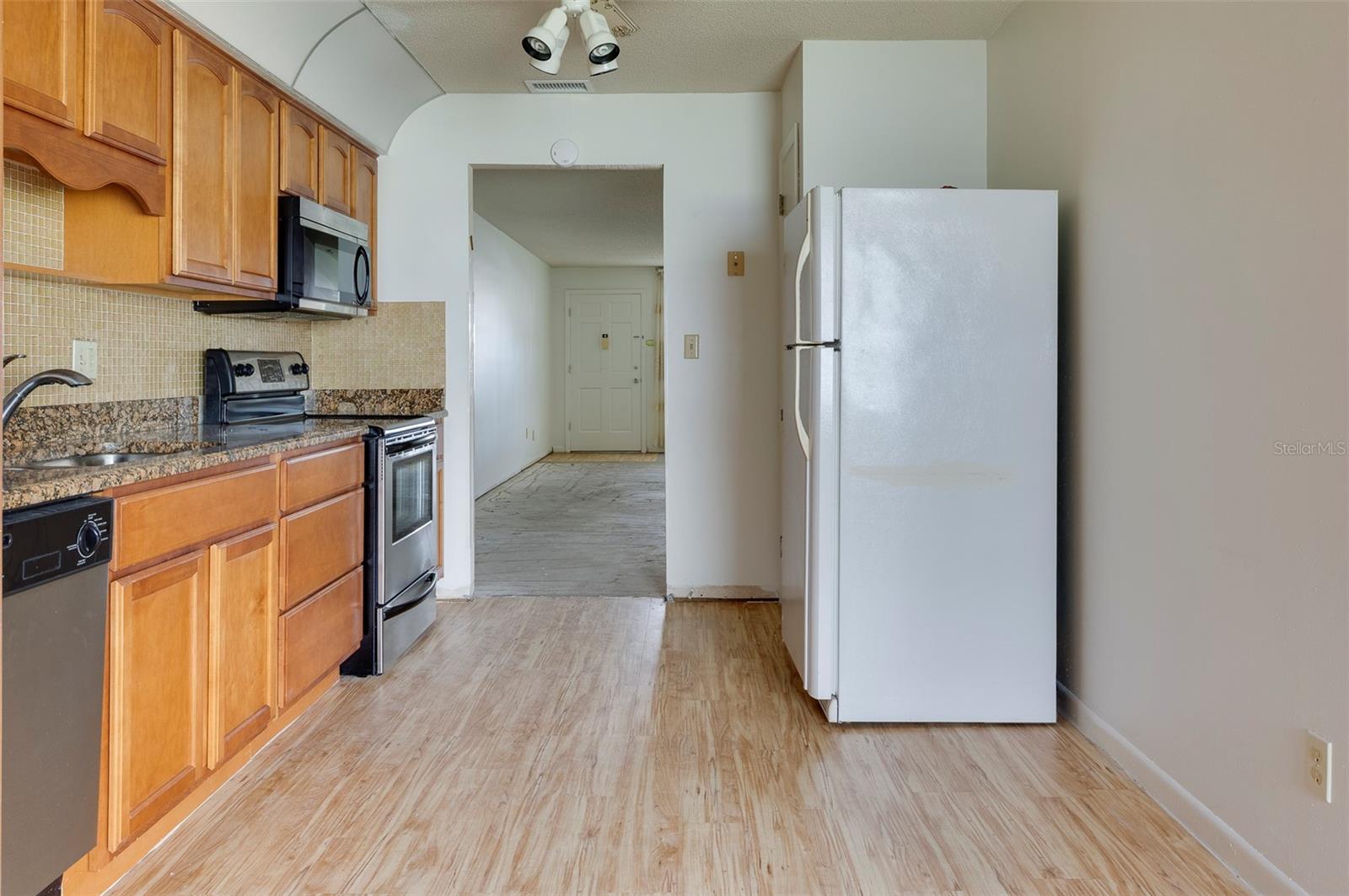 Kitchen off of the greatroom and the family room