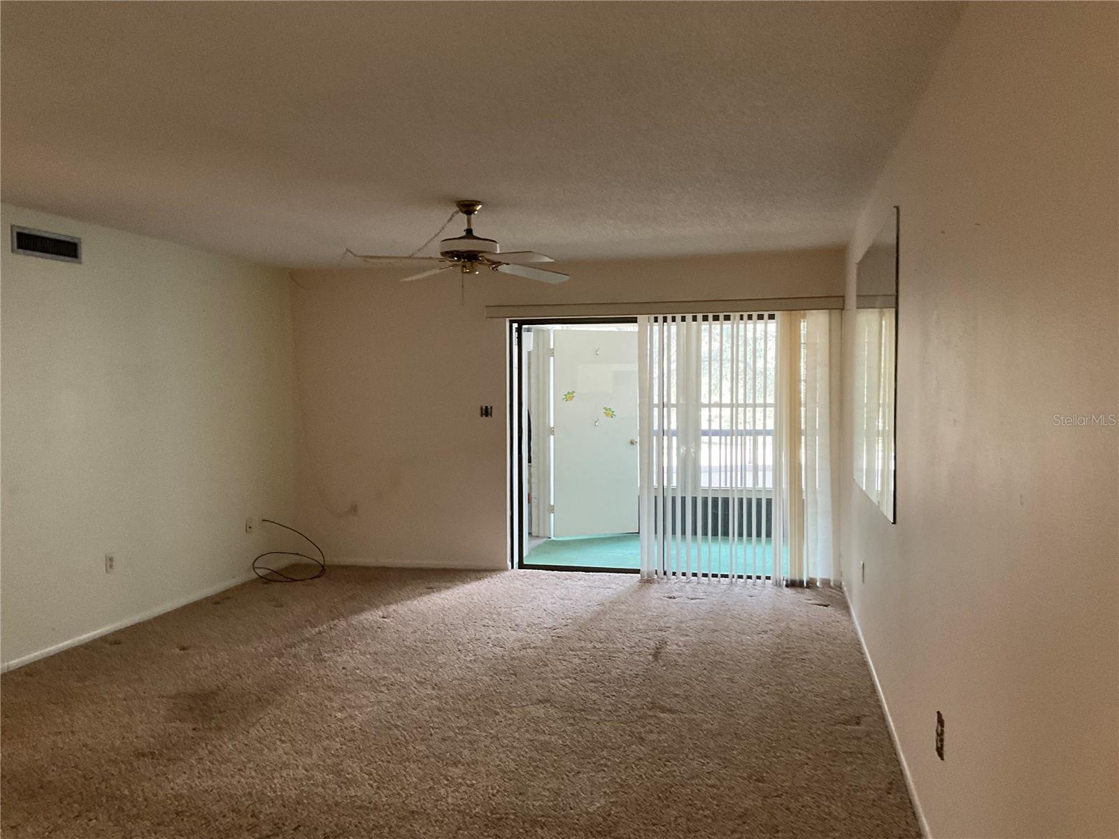 Living Room and enclosed porch with hurricane-rated window