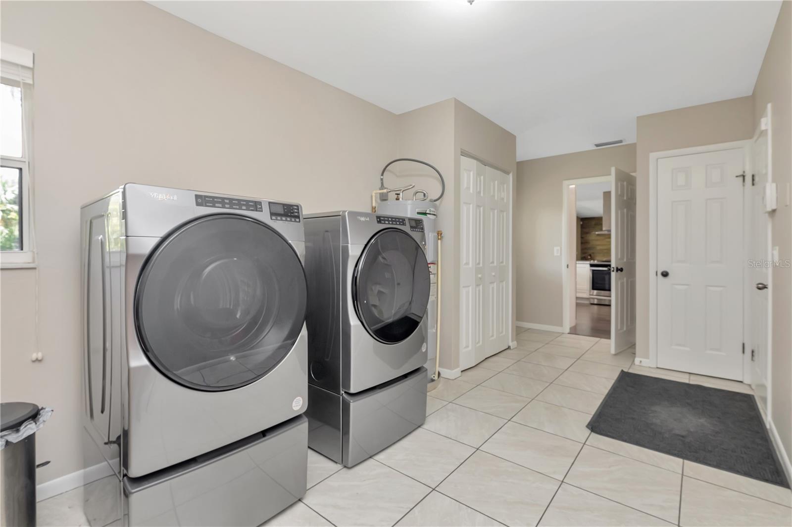 Huge Laundry Room with Access to Backyard and Garage