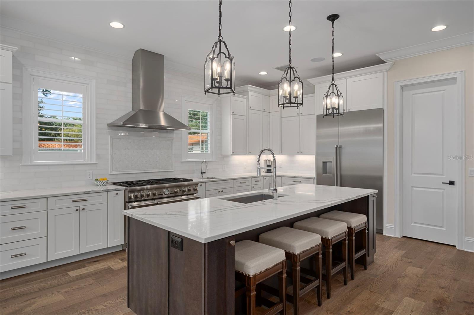 Carrara marble counters & pendant lighting