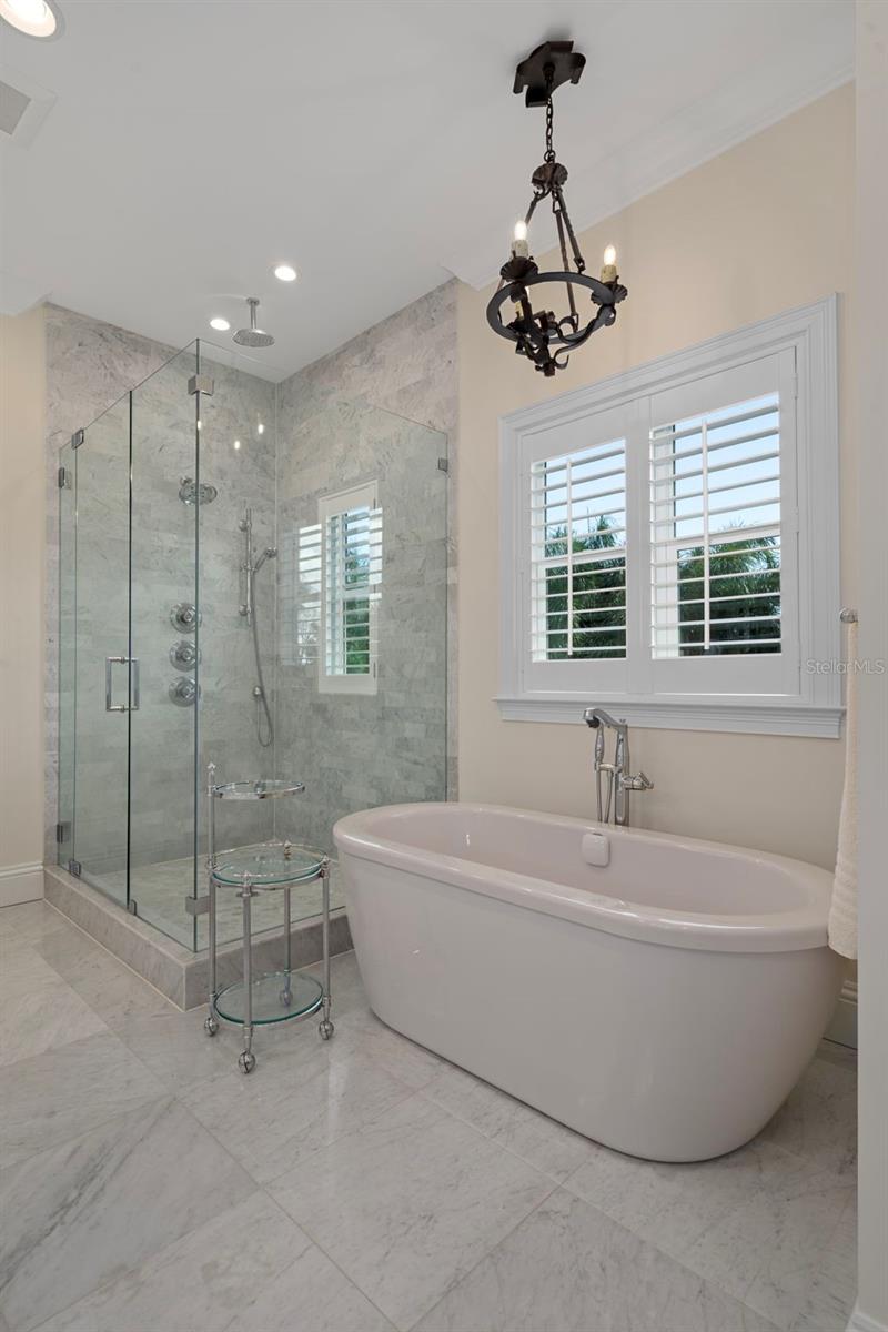 Spa-like soaking tub with marble accents