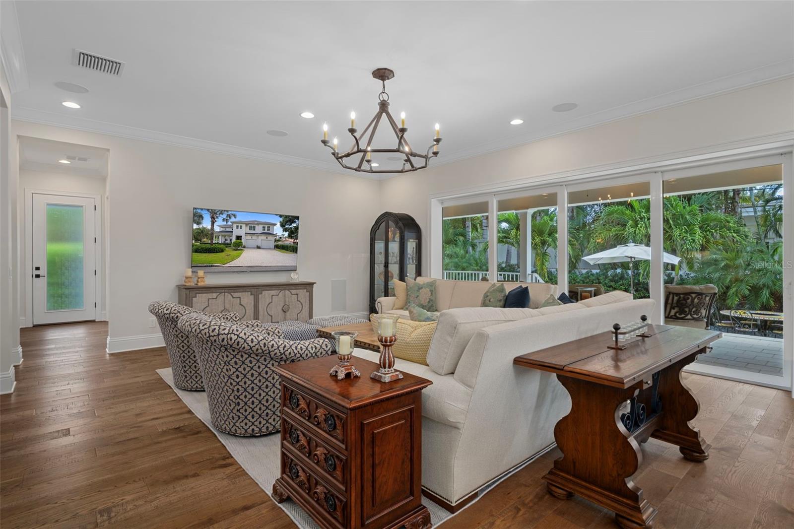 Lovely open space with the handcrafted wood flooring, ten foot ceilings and expansive window sliders that open fully onto the back porch.