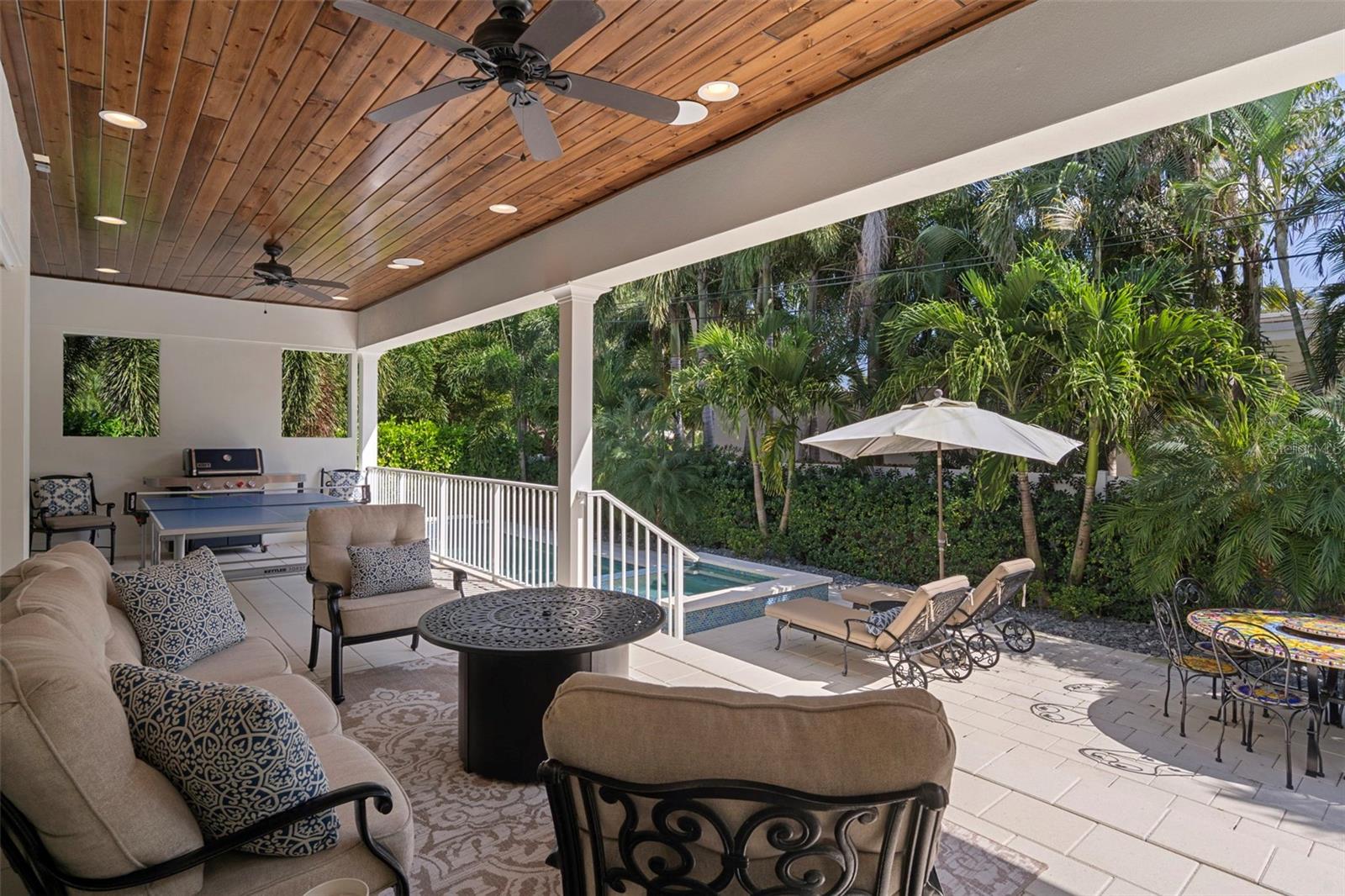 Covered lanai with tongue-and-groove ceiling and outdoor fans